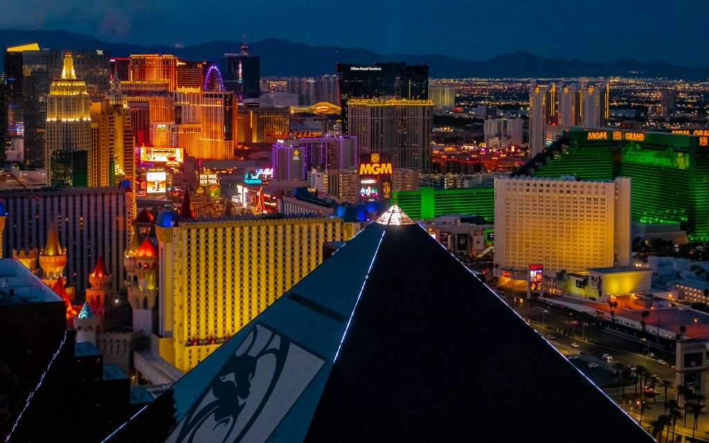 The Las Vegas Strip at night viewed along the edge of the Luxor pyramid